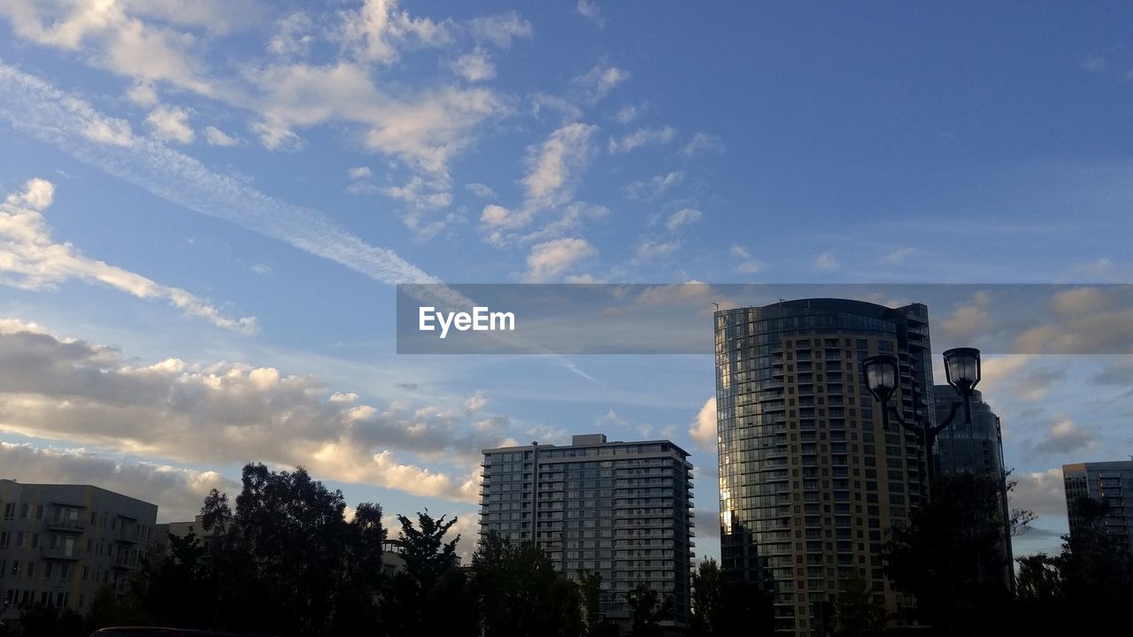 MODERN BUILDINGS IN CITY AGAINST SKY