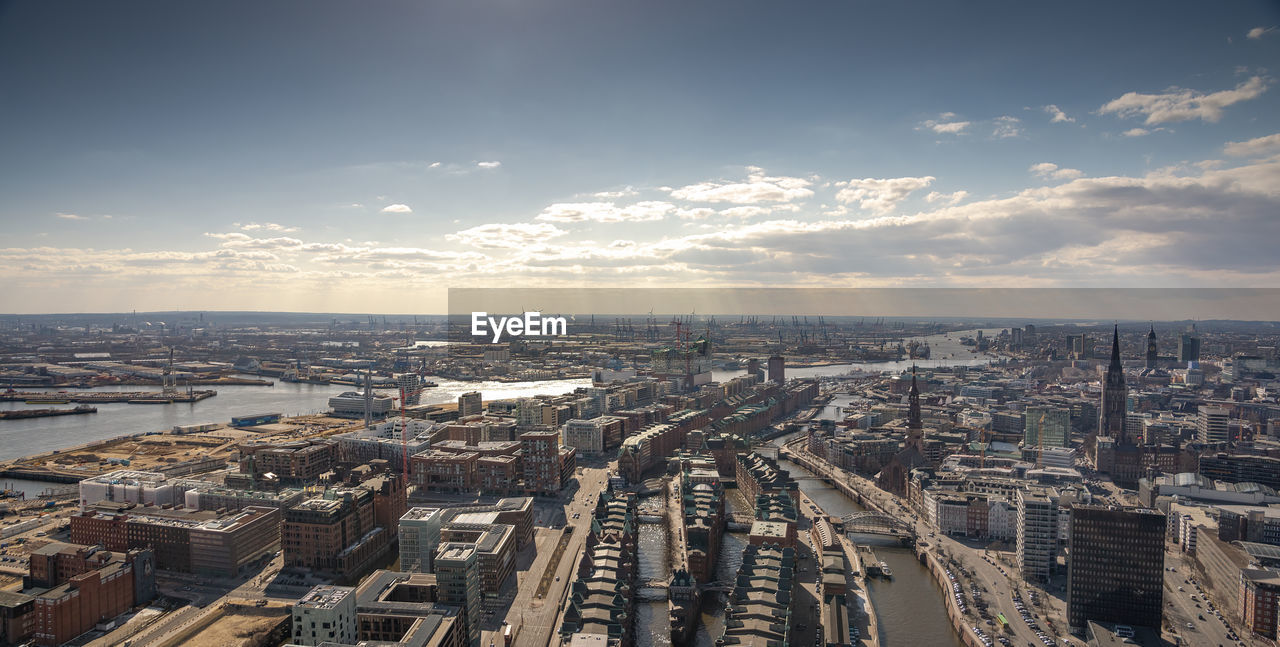 High angle view of city buildings against sky