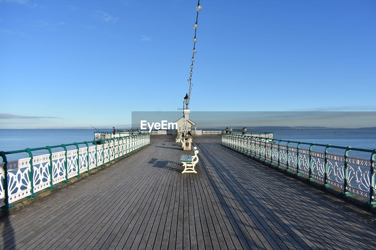 Pier over sea against sky