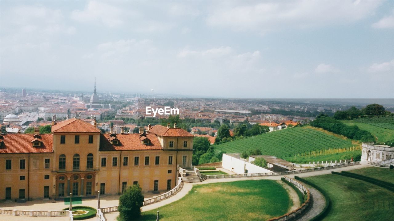 High angle view of buildings in city against sky