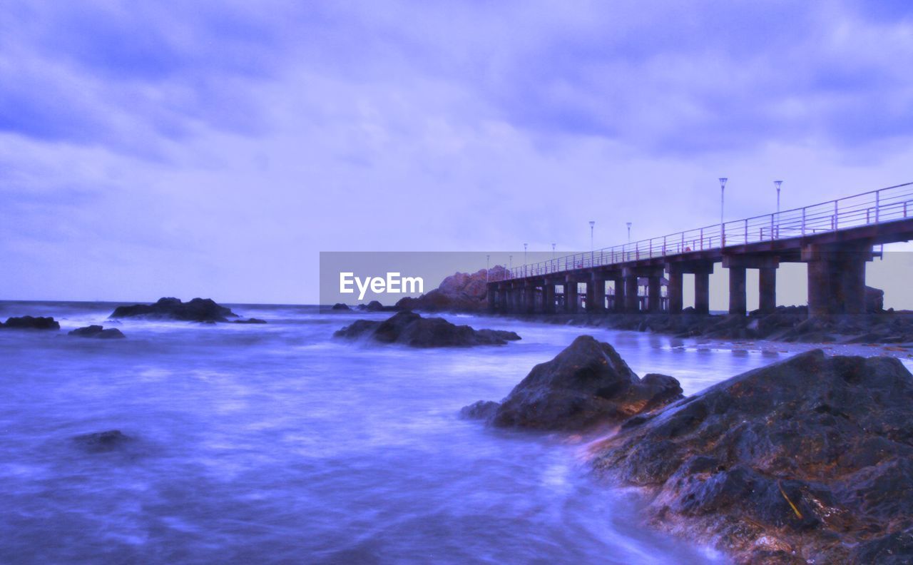 VIEW OF SEA AGAINST CLOUDY SKY