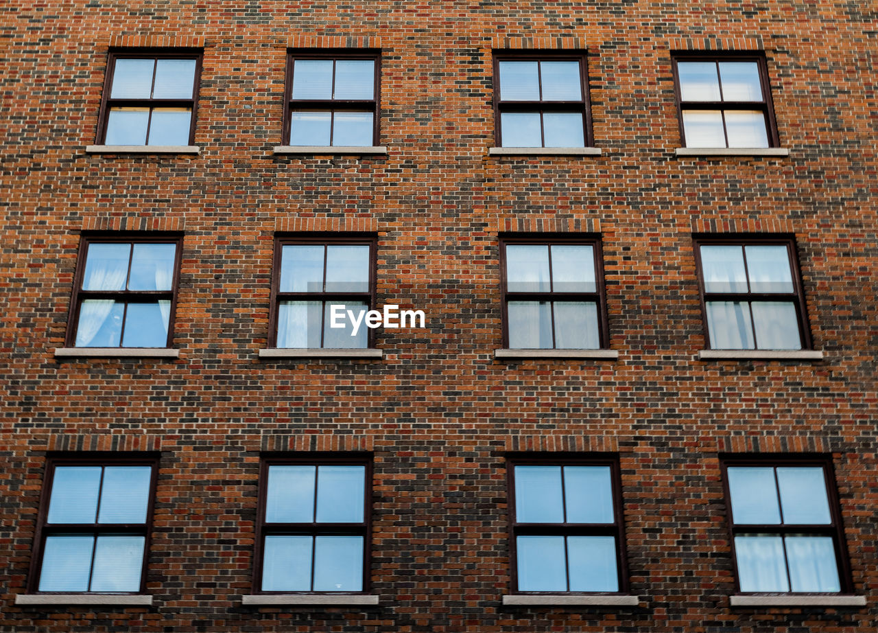 LOW ANGLE VIEW OF WINDOWS ON BUILDING