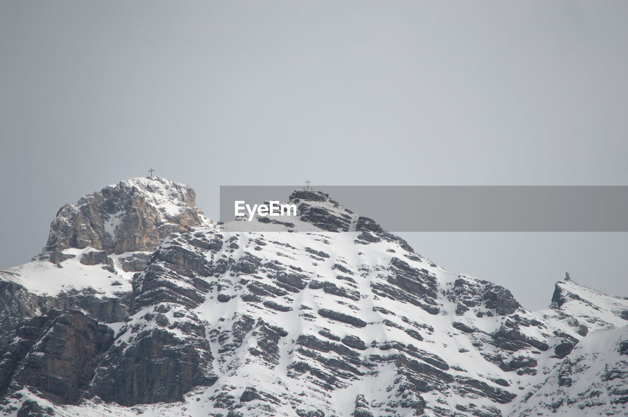 Scenic view of snowcapped mountains against clear sky