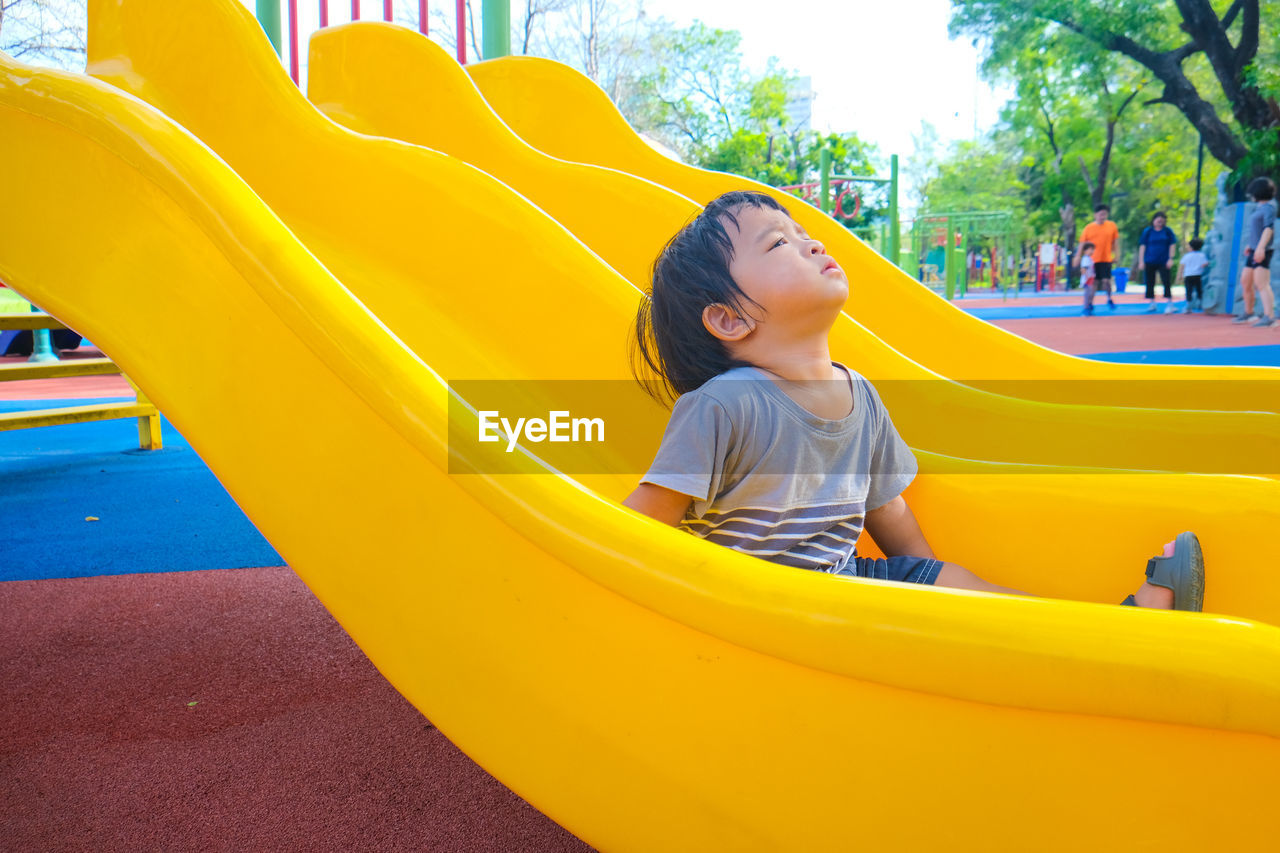 GIRL PLAYING IN PLAYGROUND