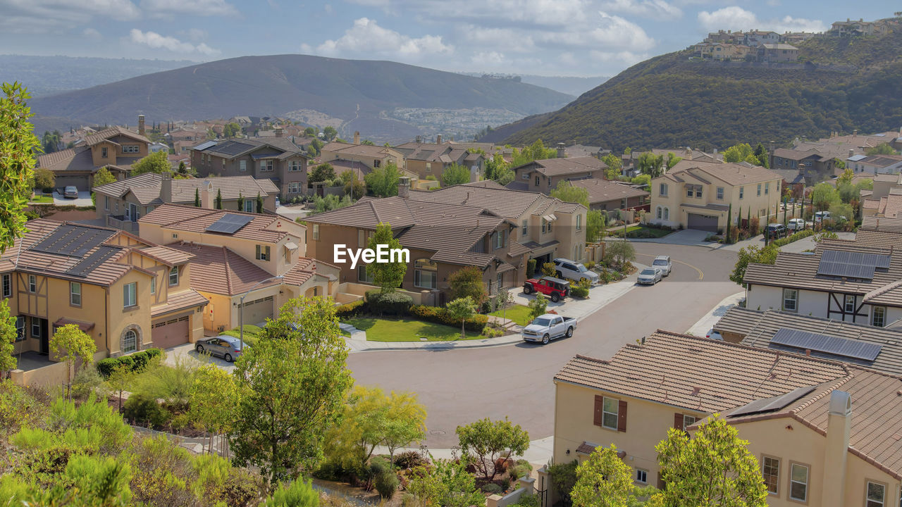 high angle view of townscape against mountain