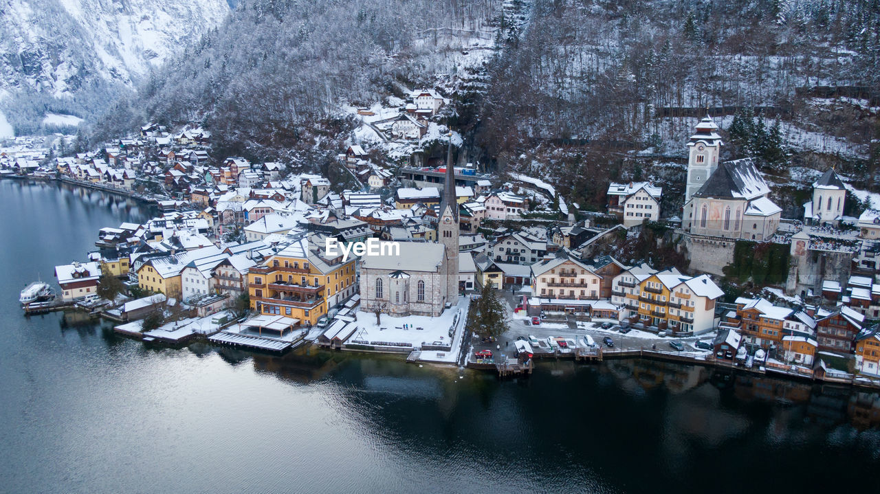 Aerial view of townscape by river during winter