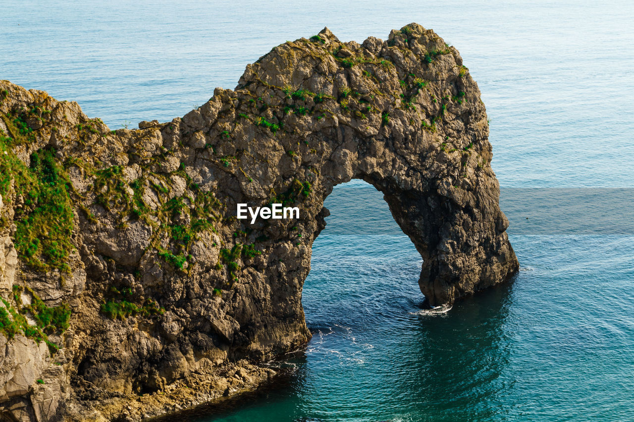 Scenic view of rock formation in sea