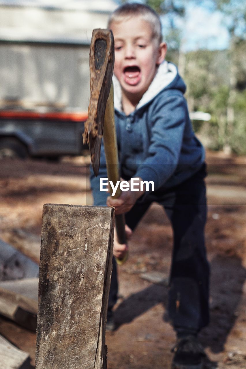 Child chopping wood