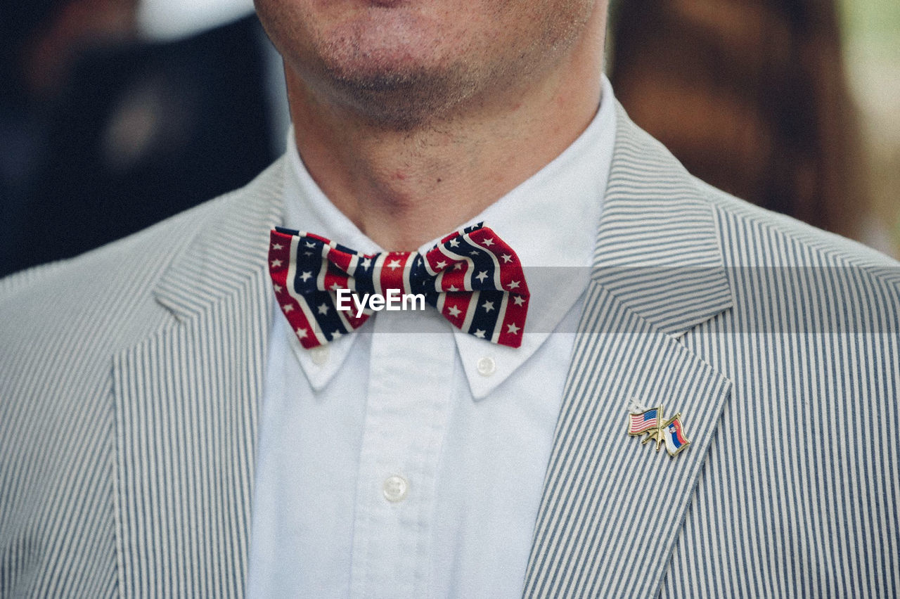 Midsection of man wearing bow tie