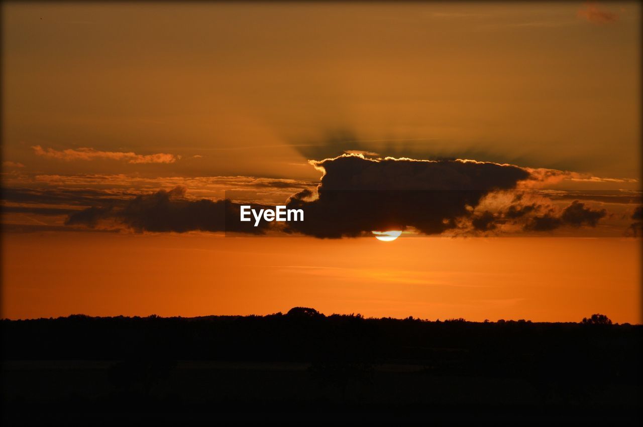 Scenic view of landscape against sky during sunset