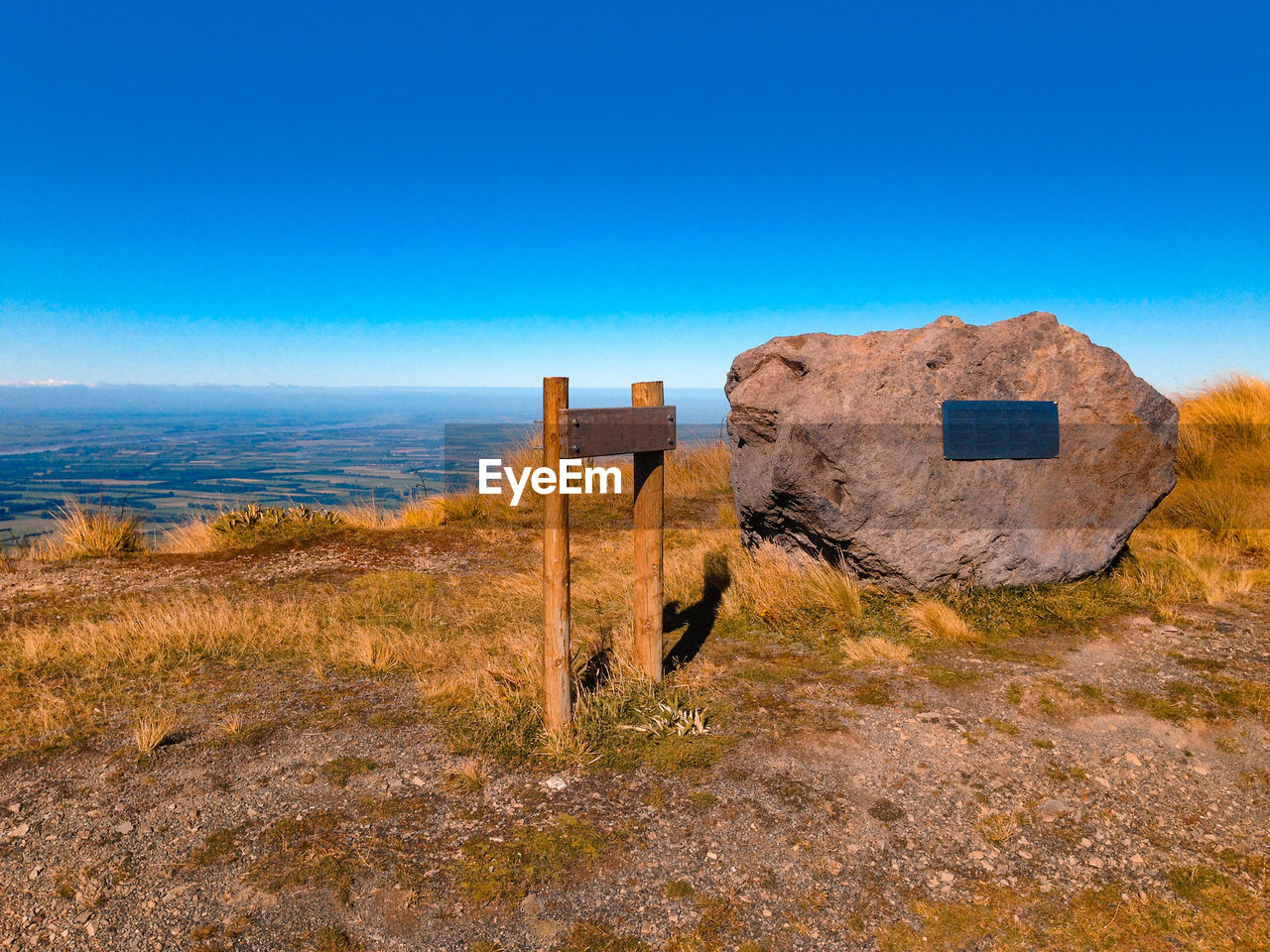 BUILT STRUCTURE ON LAND AGAINST BLUE SKY