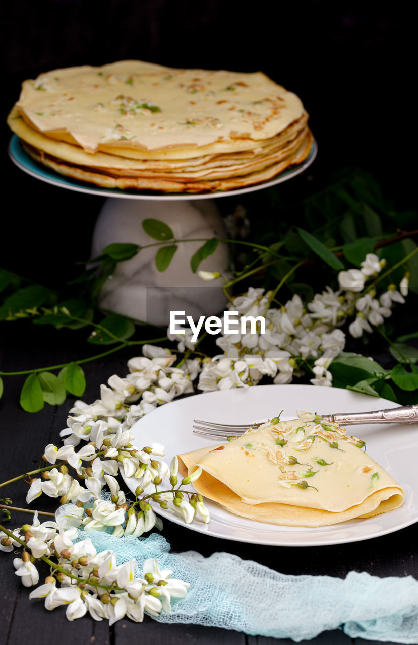 Vegan black locust flower pancakes recipe with foraged ingredients .