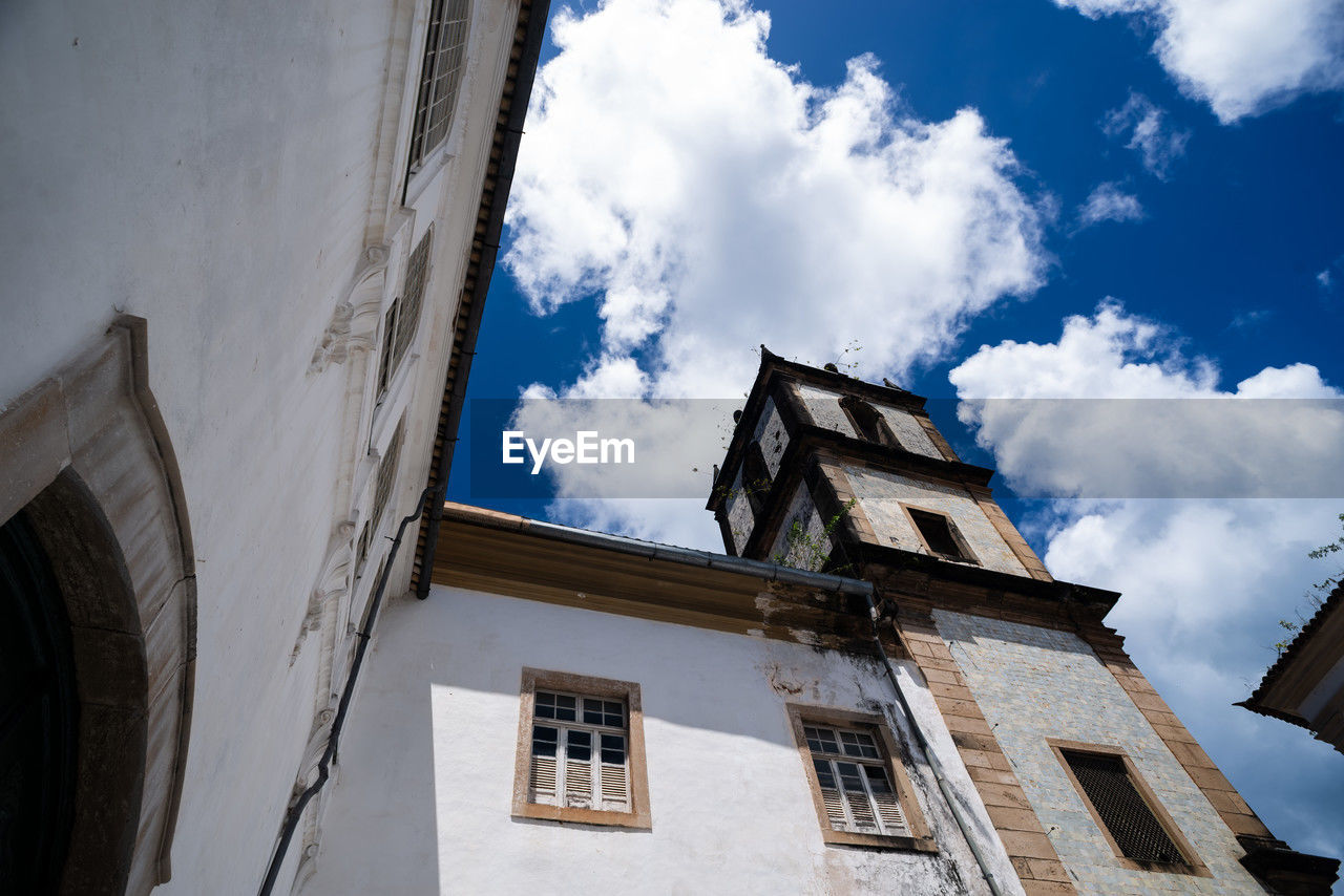 architecture, blue, building exterior, built structure, sky, cloud, building, low angle view, window, nature, no people, history, the past, city, urban area, house, travel destinations, day, residential district, facade, outdoors, travel, tower, religion, tourism, old, place of worship