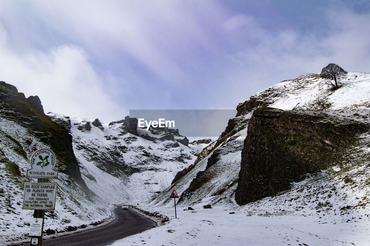 SCENIC VIEW OF SNOW COVERED MOUNTAIN AGAINST SKY