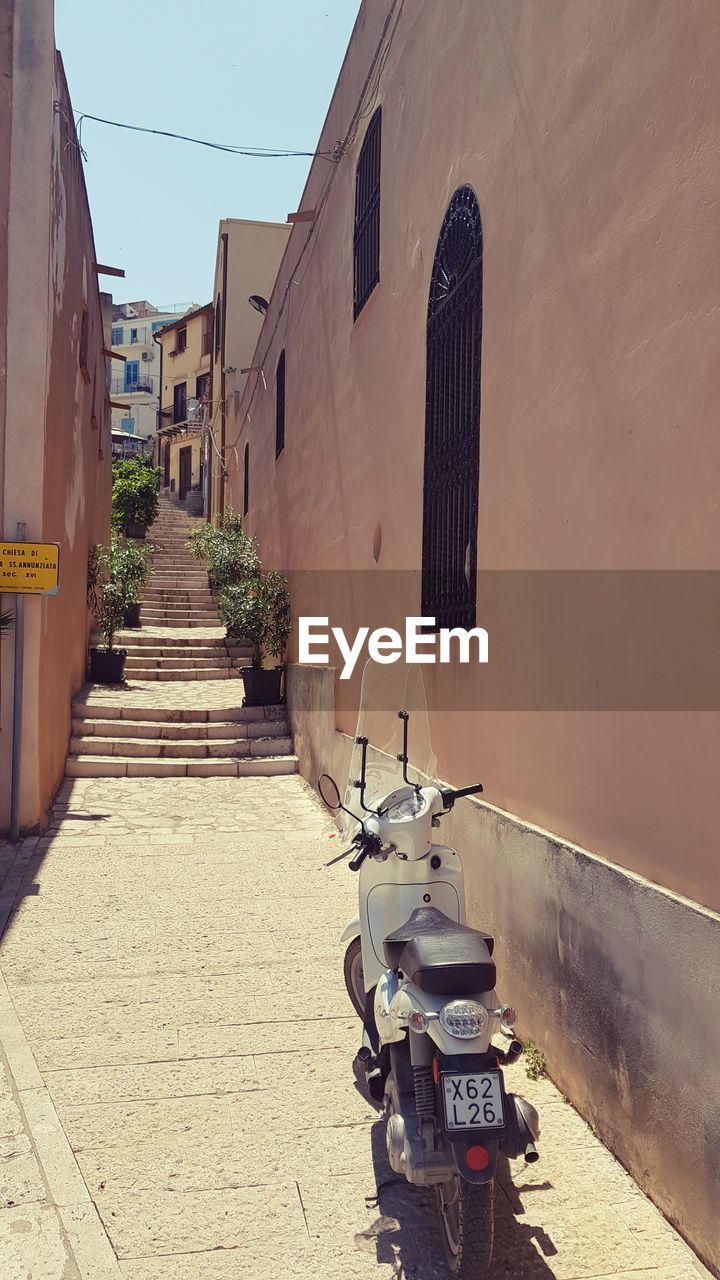 STAIRCASE AMIDST BUILDINGS IN CITY