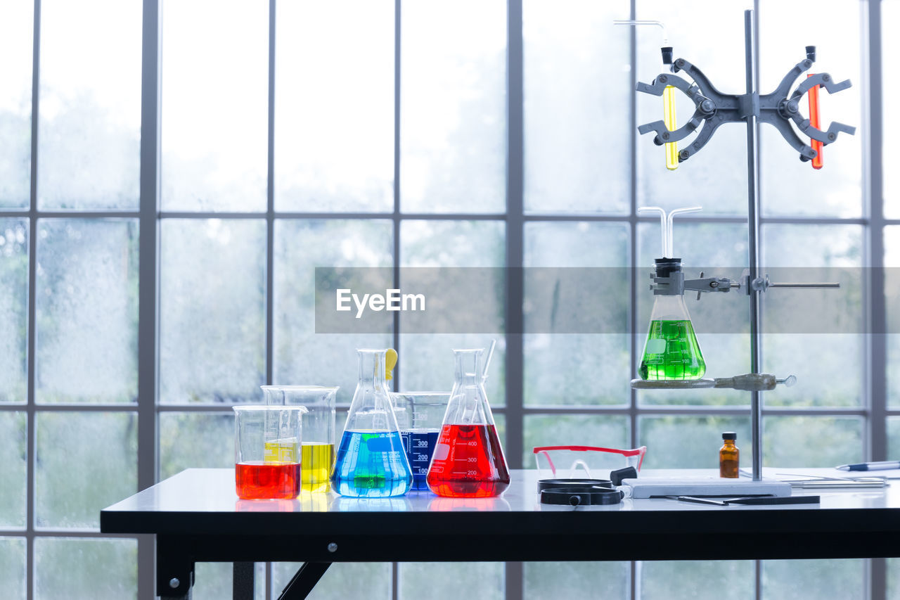 Laboratory equipment on table against window