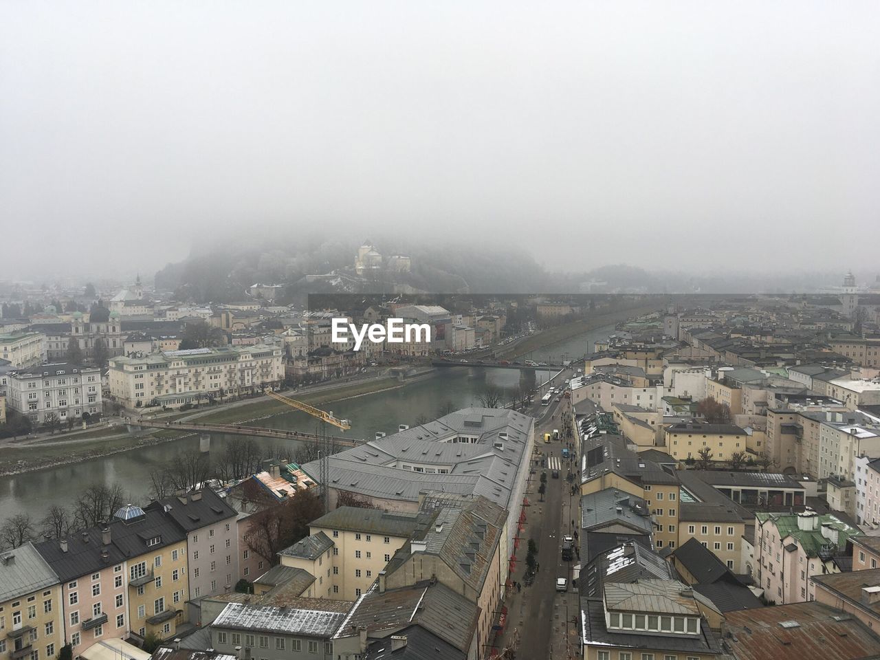 HIGH ANGLE VIEW OF CITY IN FOGGY WEATHER
