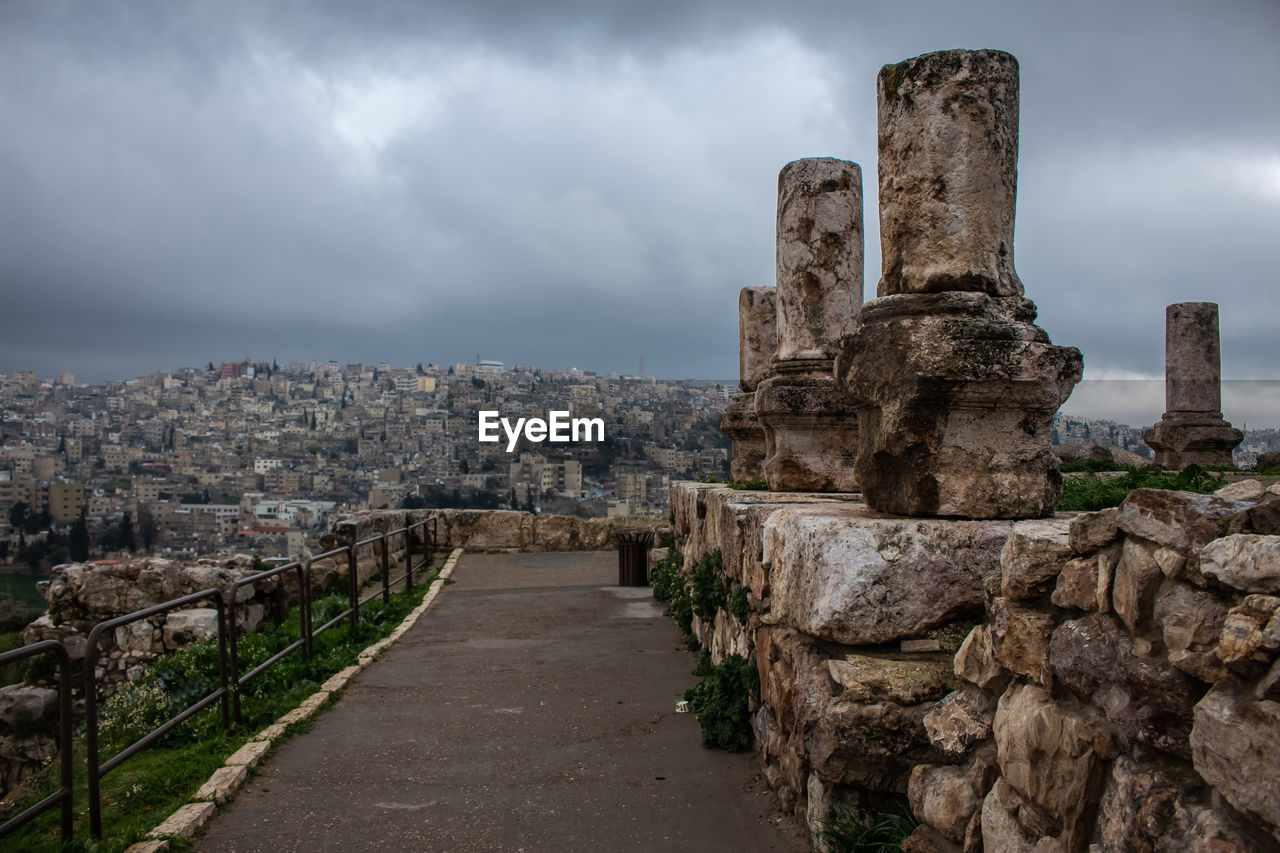 HISTORIC BUILDING AGAINST CLOUDY SKY