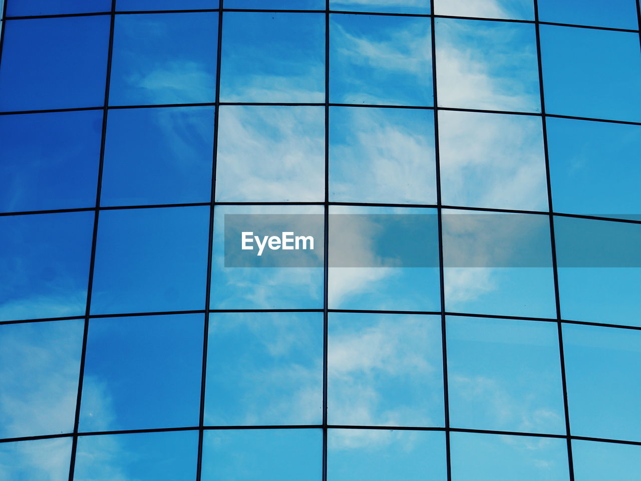 Full frame shot of modern glass building 