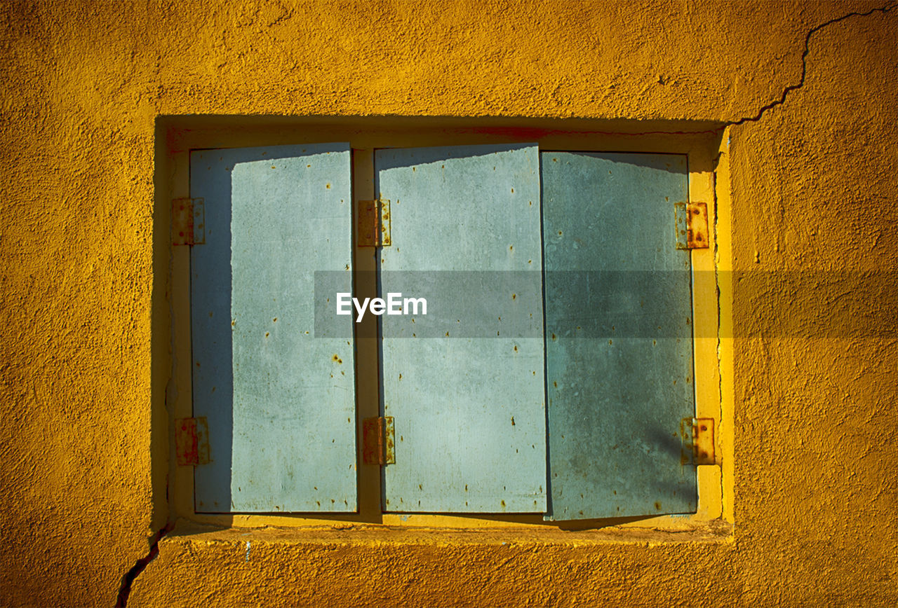 Close-up of closed window of house