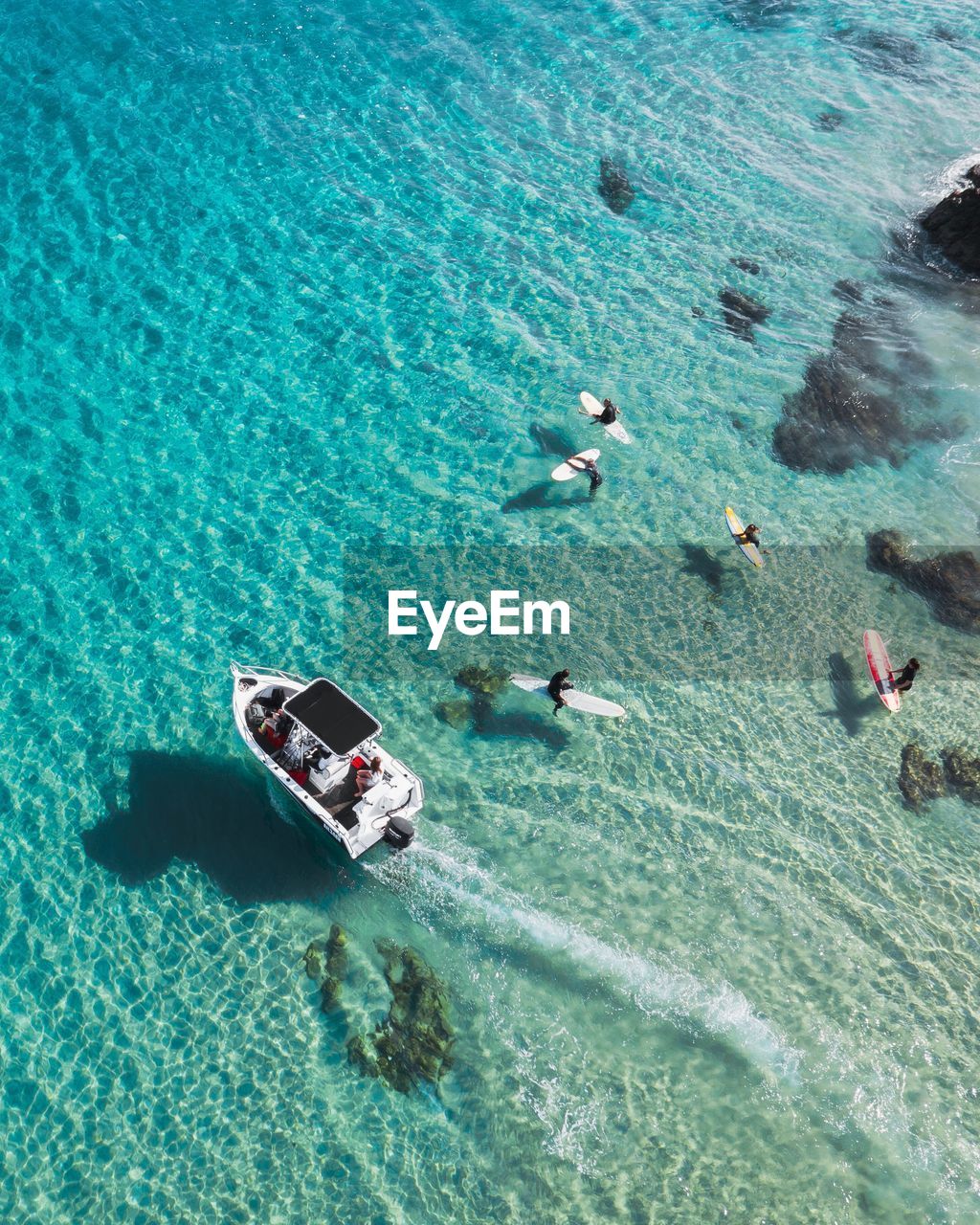 High angle view of people swimming in sea