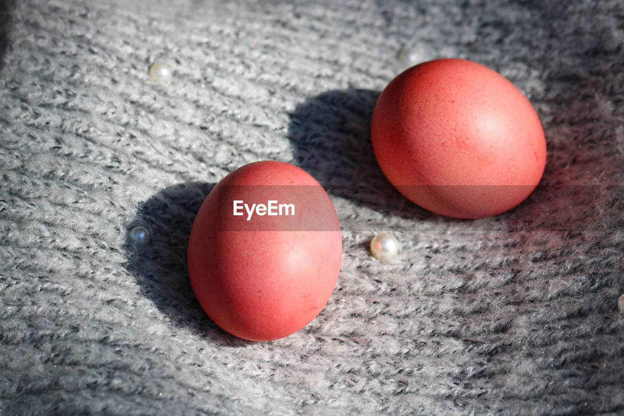 Pink easter eggs on a gray background