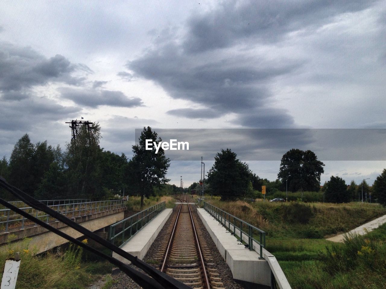 Railroad track seen through train windshield