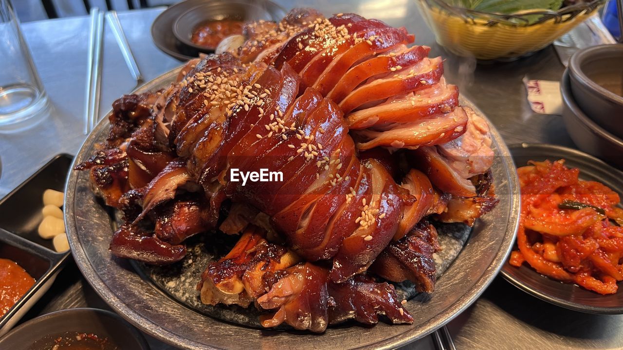 food and drink, food, meat, freshness, meal, table, dish, no people, dinner, plate, household equipment, healthy eating, drink, roasted, indoors, roasting, high angle view, cuisine, alcohol, wellbeing, gourmet, still life, seafood, refreshment, restaurant, peking duck, wine, serving size, cooked