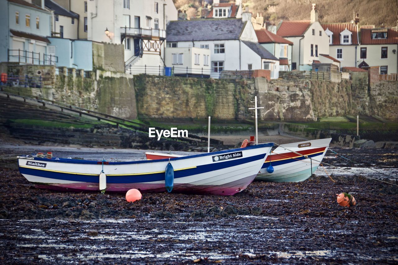 Boats moored at waterfront