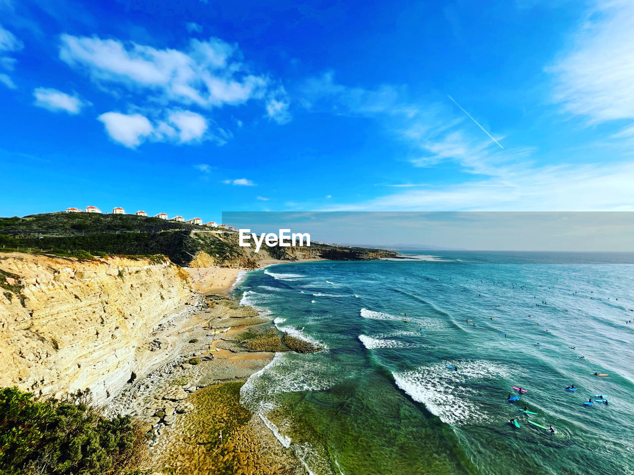 sea, water, sky, land, beach, scenics - nature, ocean, coast, beauty in nature, shore, body of water, nature, horizon, cloud, blue, cliff, wave, environment, coastline, travel, travel destinations, horizon over water, landscape, terrain, tranquility, tranquil scene, no people, bay, rock, outdoors, tourism, day, water sports, sand, vacation, motion, seascape, cove, idyllic, sports, holiday, summer, trip, sunlight, wind wave, non-urban scene