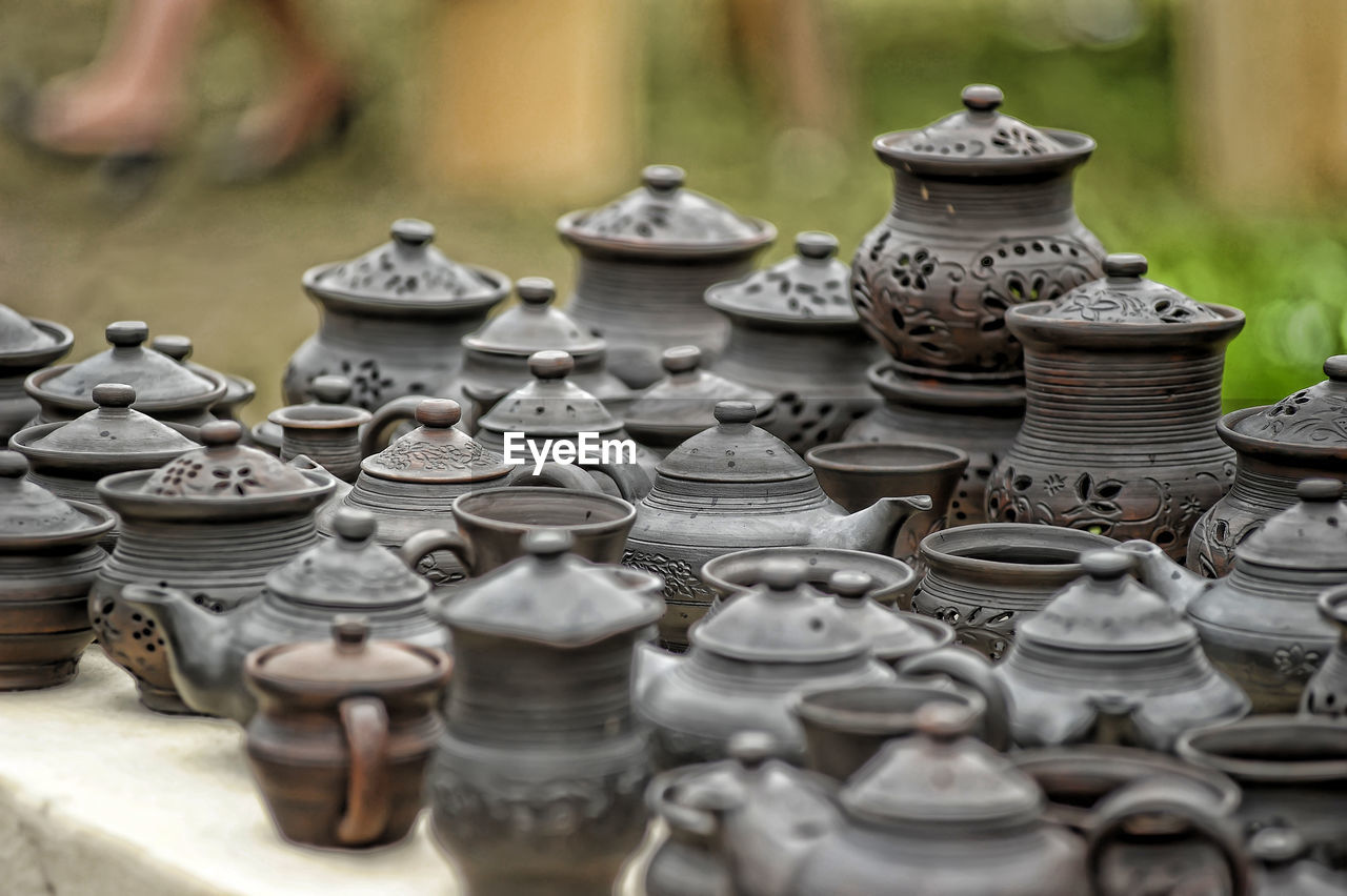 CLOSE-UP OF CANDLES ON ROW