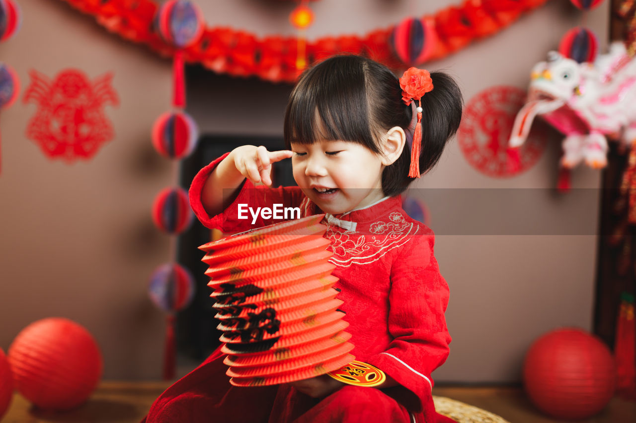 Cute girl standing in traditional clothing