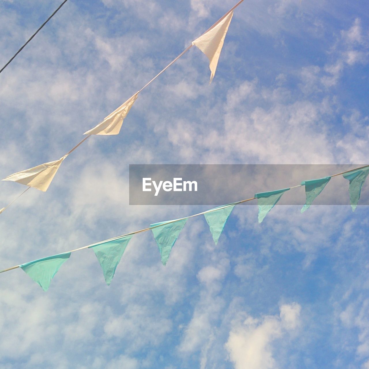 Decorative bunting against cloudy sky