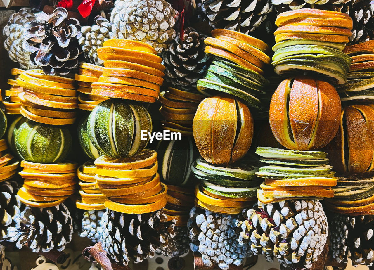 large group of objects, yellow, for sale, abundance, retail, multi colored, no people, variation, market, arrangement, full frame, still life, backgrounds, food, food and drink, market stall, pattern, business finance and industry, art, in a row, small business, indoors, business, store, day, retail display, close-up, high angle view