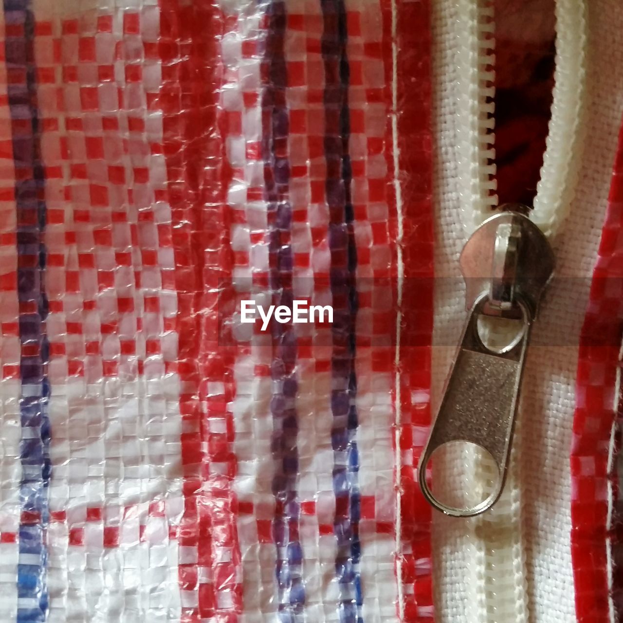 Close-up of metal zipper on sack