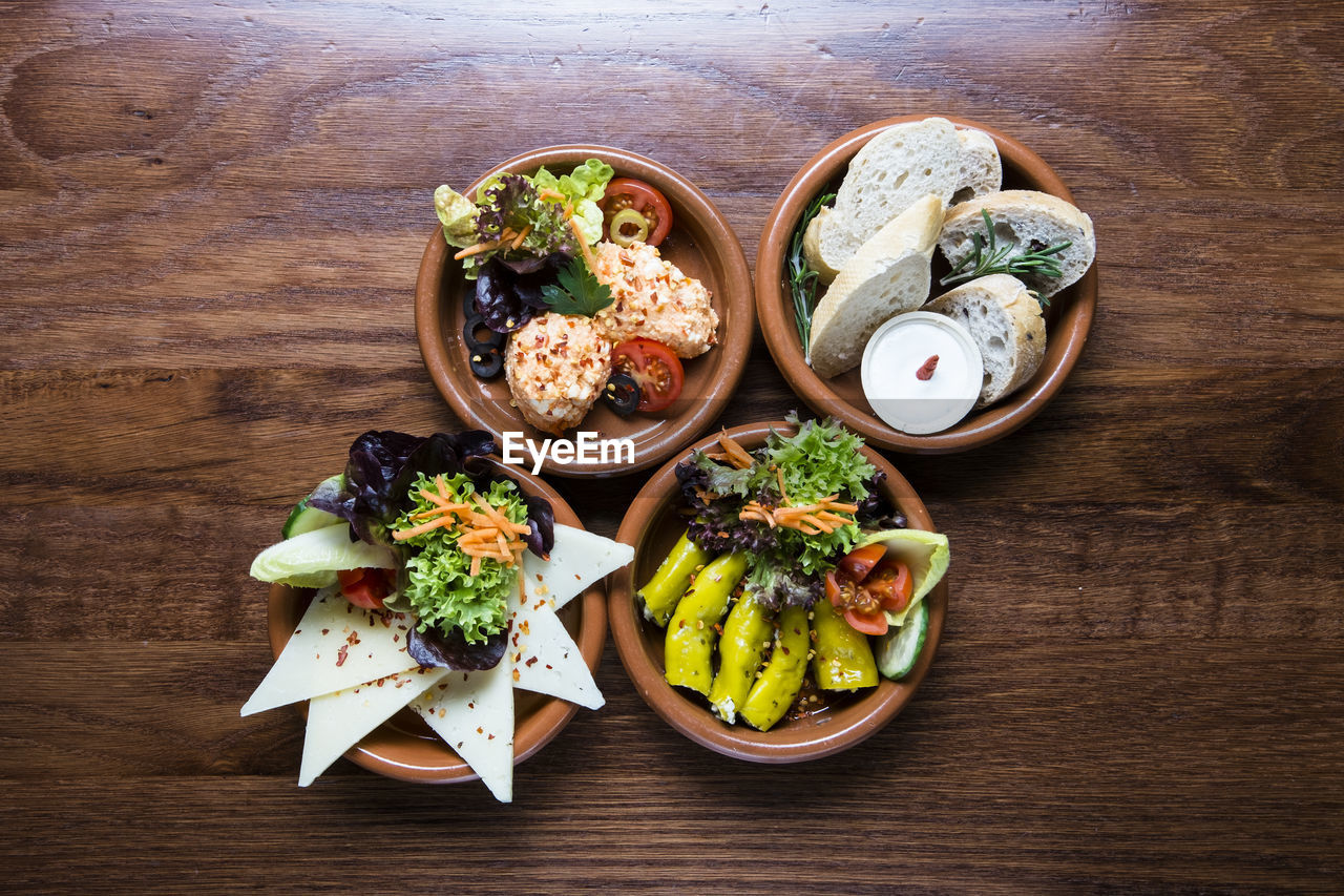 HIGH ANGLE VIEW OF VARIOUS VEGETABLES ON TABLE