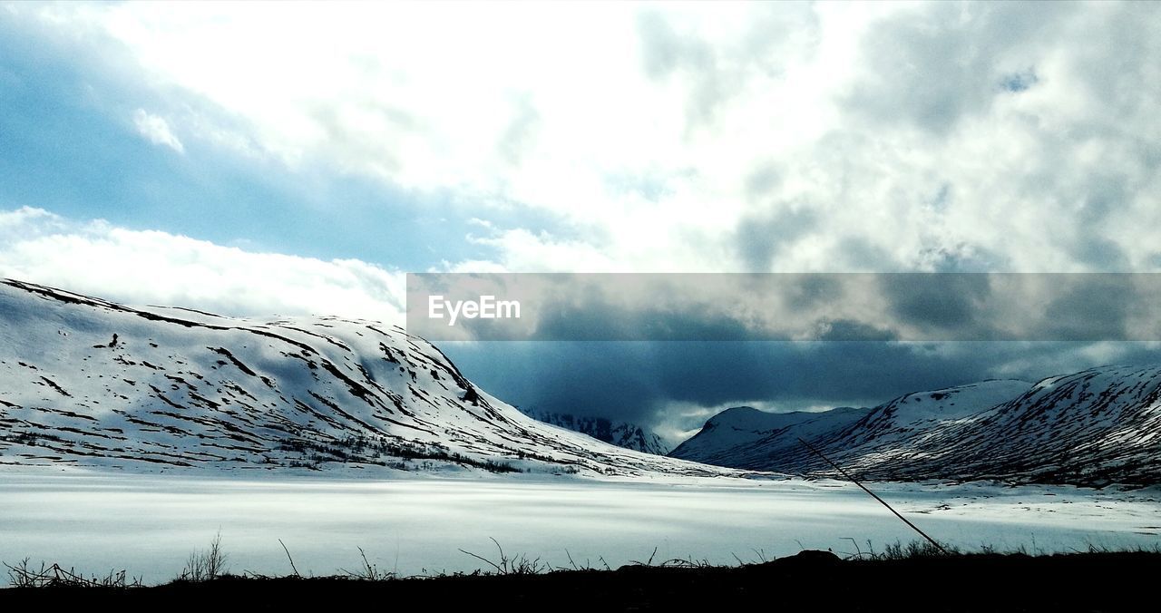 SCENIC VIEW OF MOUNTAIN AGAINST SKY