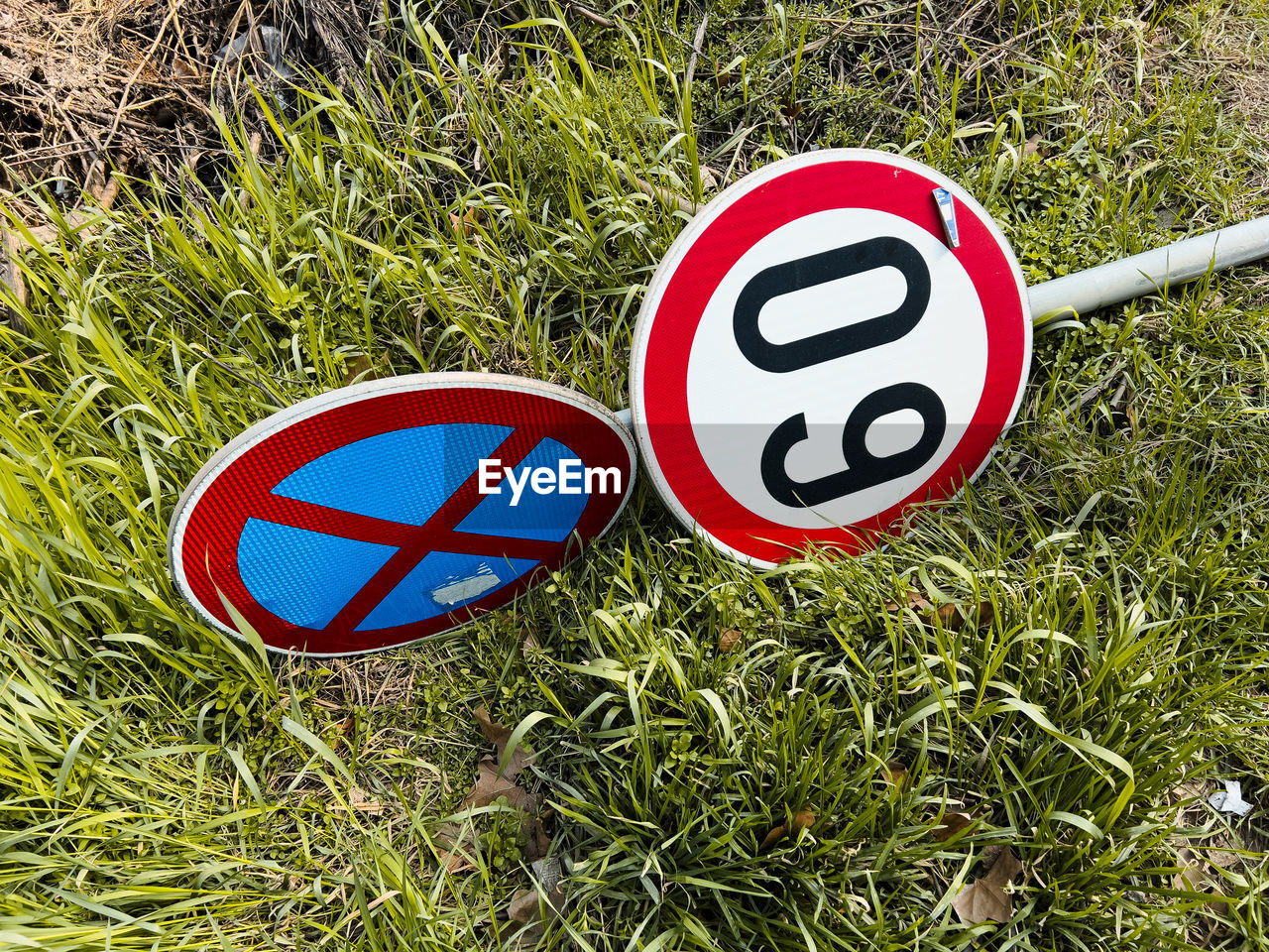 close-up of road sign on grassy field