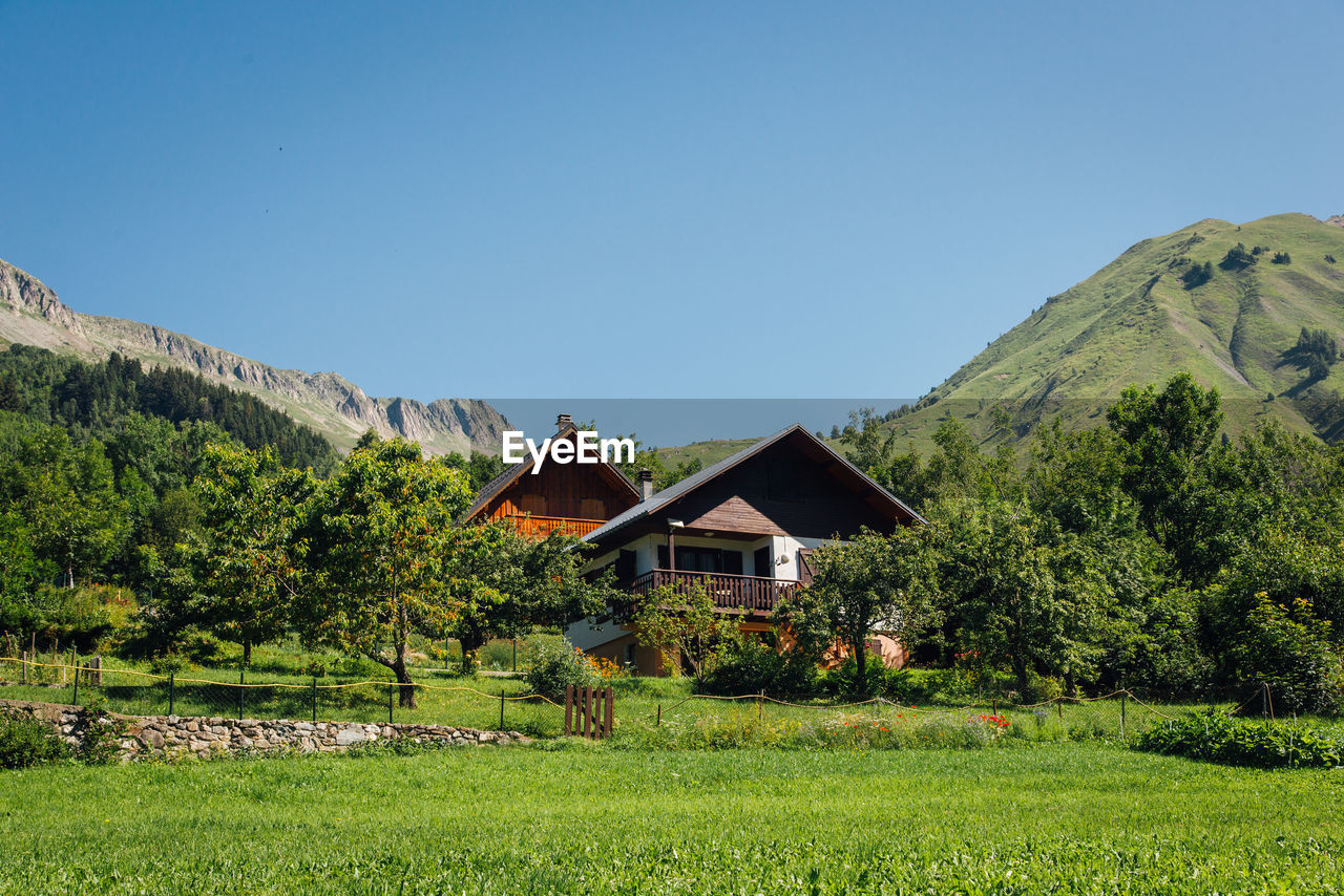 Scenic view of mountain chalets in summer. a mountain village in summer.