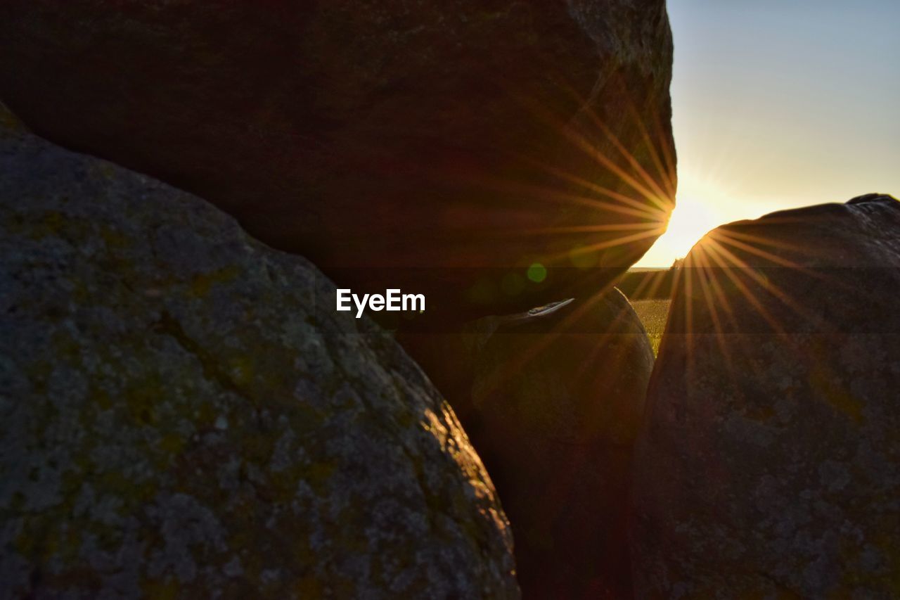 Close-up of rock formation against sky during sunset