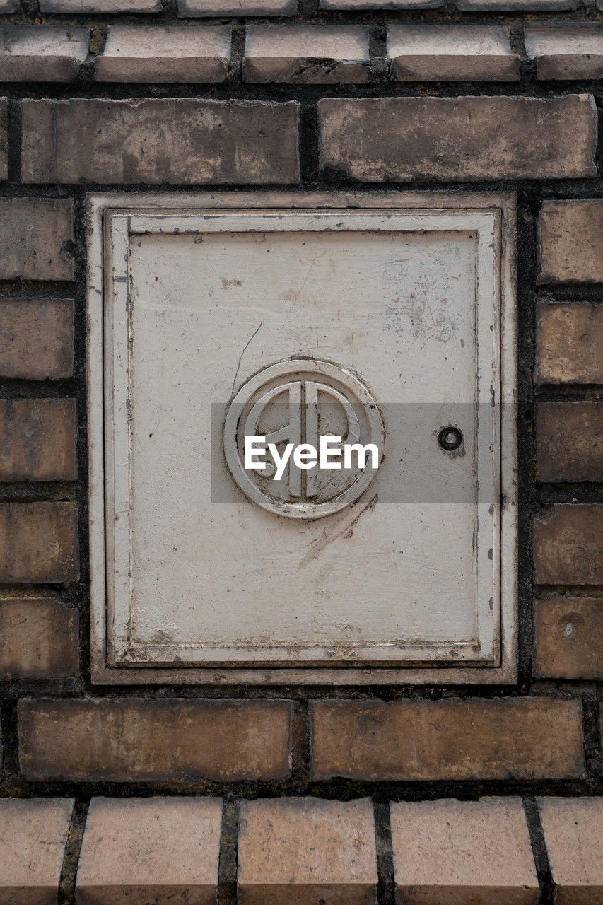 wall, iron, no people, architecture, brick, wall - building feature, built structure, day, number, window, white, close-up, pattern, wood, black, brick wall, geometric shape, building exterior, shape, outdoors, metal, communication, full frame