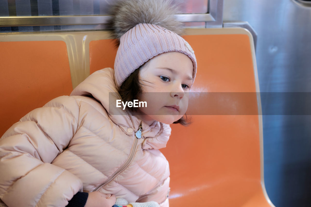 Cute young girl on the train in nyc