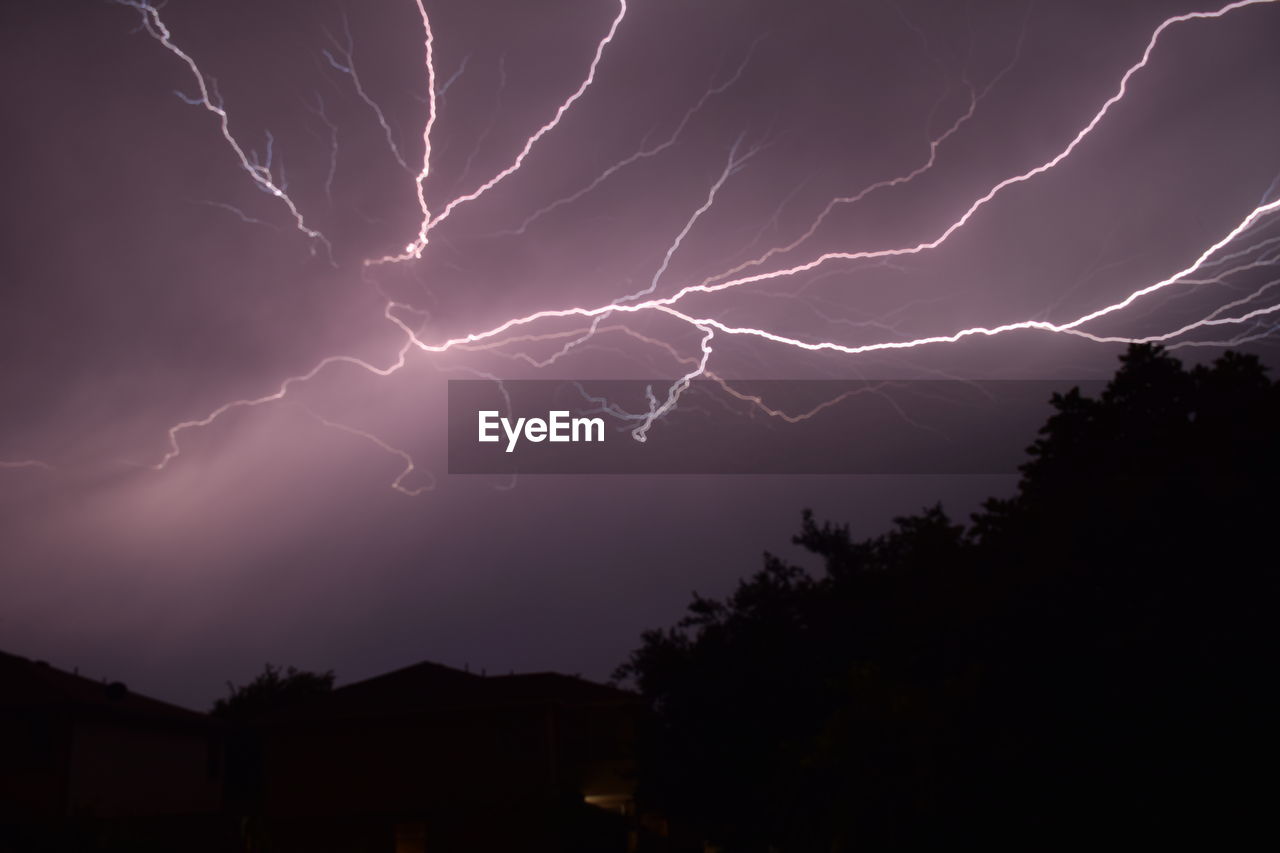LOW ANGLE VIEW OF LIGHTNING AT NIGHT
