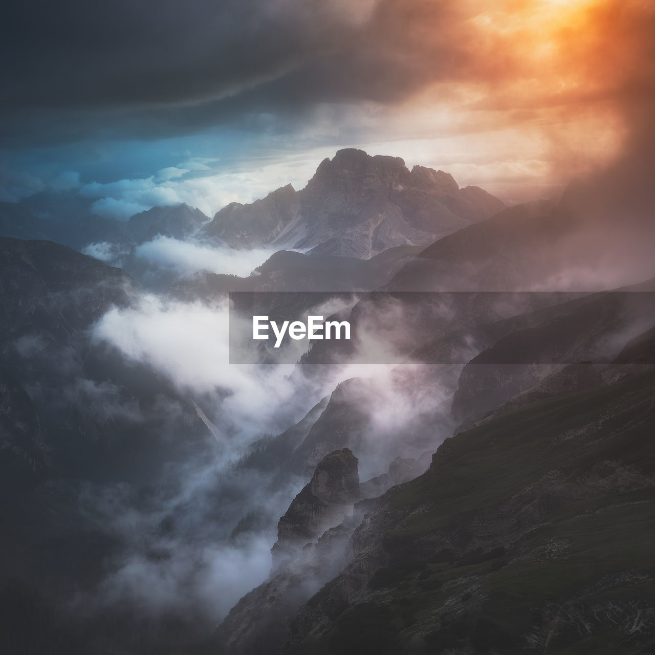 Moody landscape with dolomite mountains in perfect sunset light.