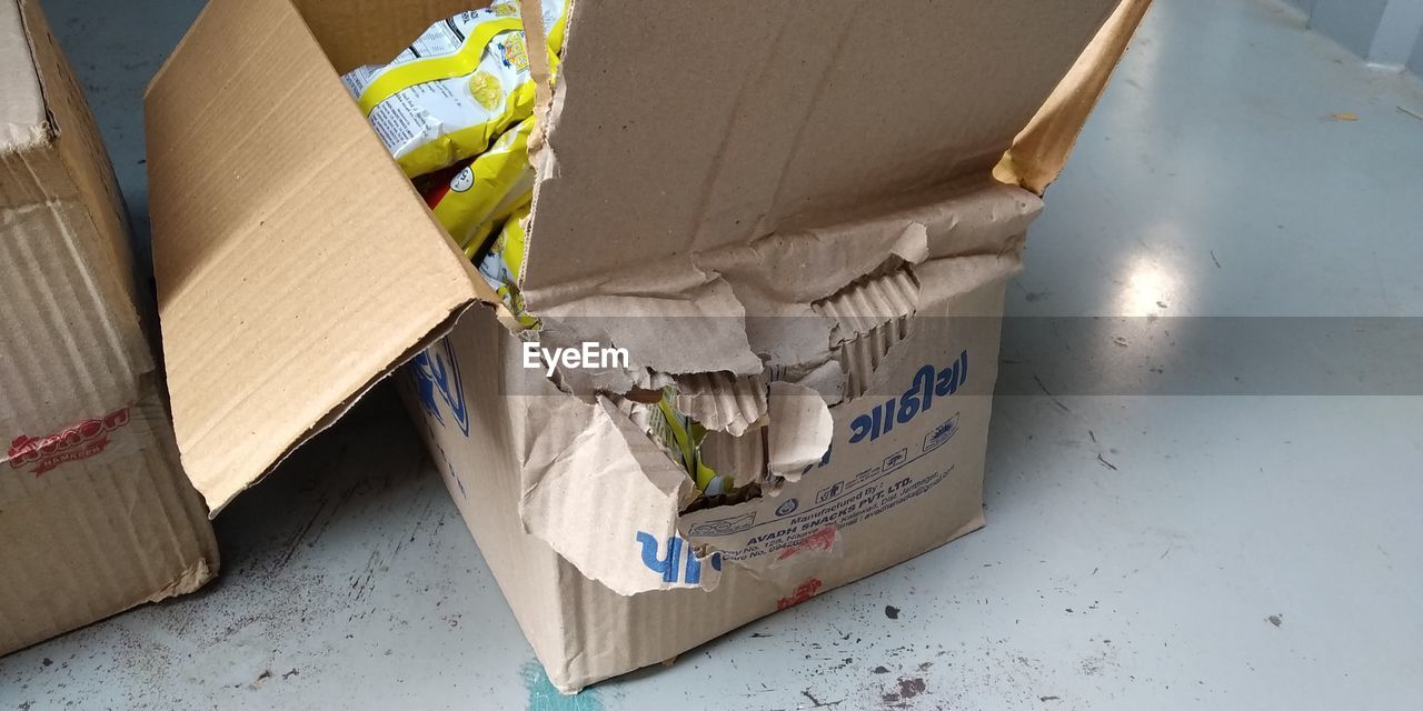 HIGH ANGLE VIEW OF GARBAGE ON BOX