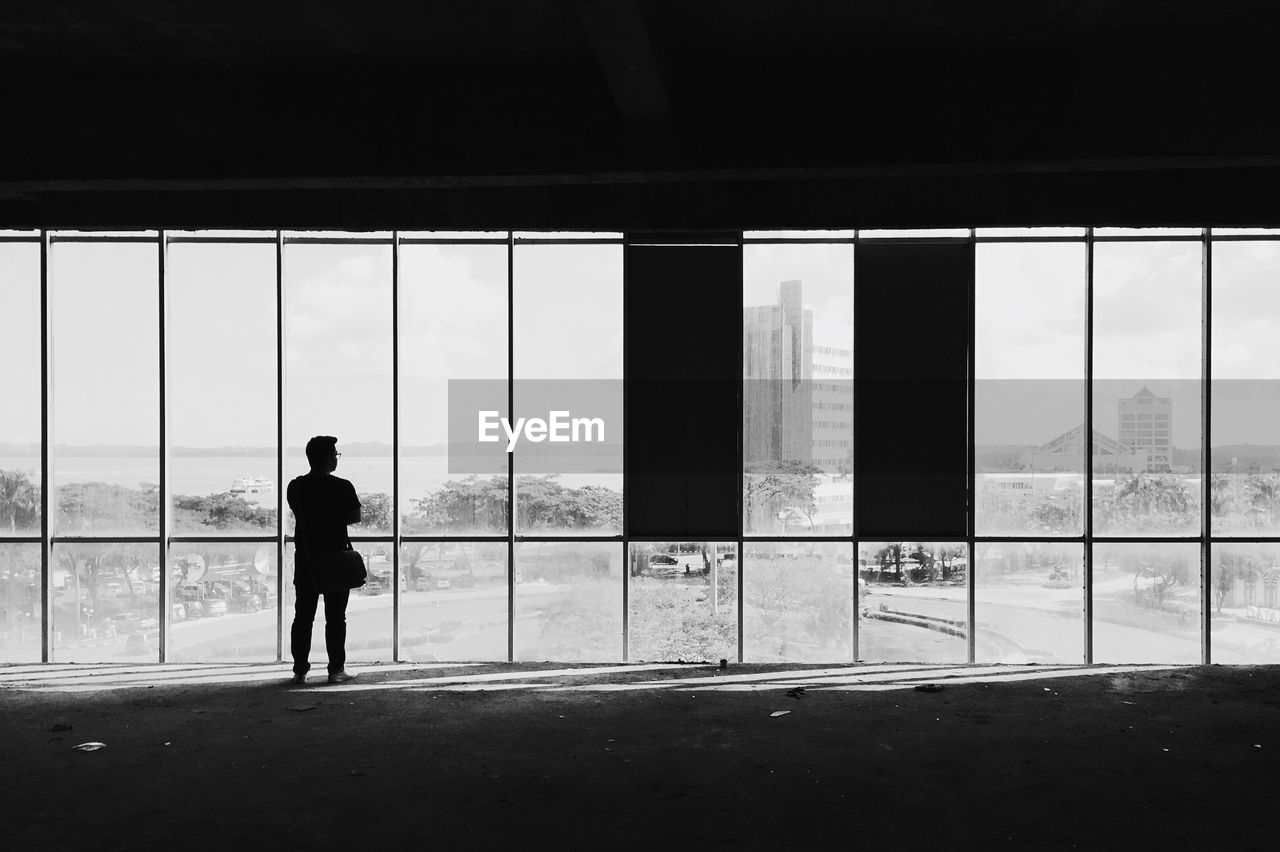 MAN STANDING BY AIRPORT