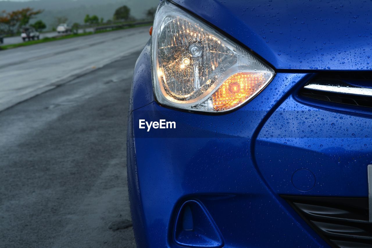 Close-up of illuminated car headlight