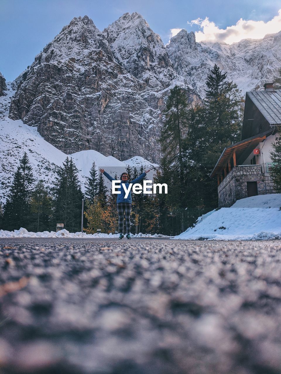 Rear view of woman on snowcapped mountain