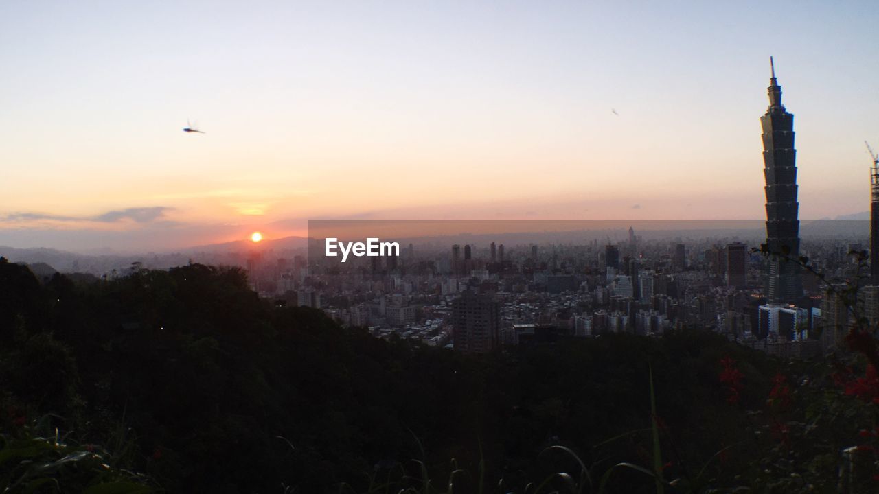 AERIAL VIEW OF CITY AT SUNSET