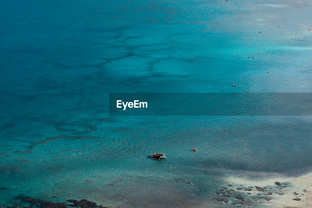 Scenic view of sea against blue sky